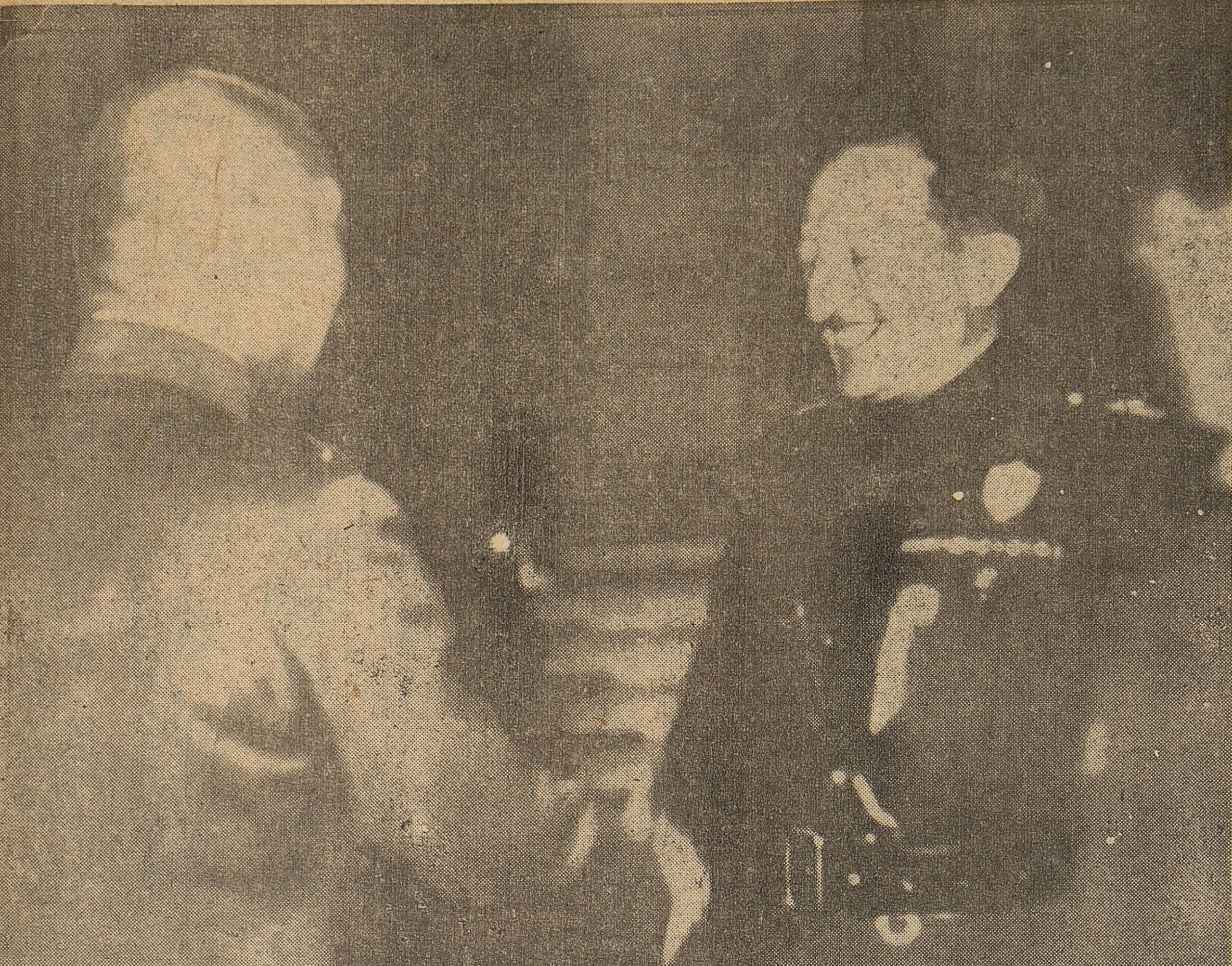 Marquis Paulucci and Governor-General Minami Jiro shaking hands.